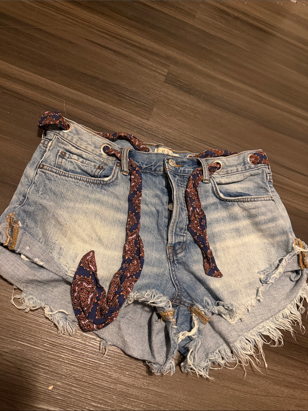 Free people we the free. Light Wash Distressed Denim Shorts with Paisley Tie